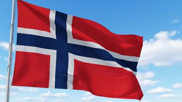 Norwegian flag waving in the wind against a serene blue sky with white clouds