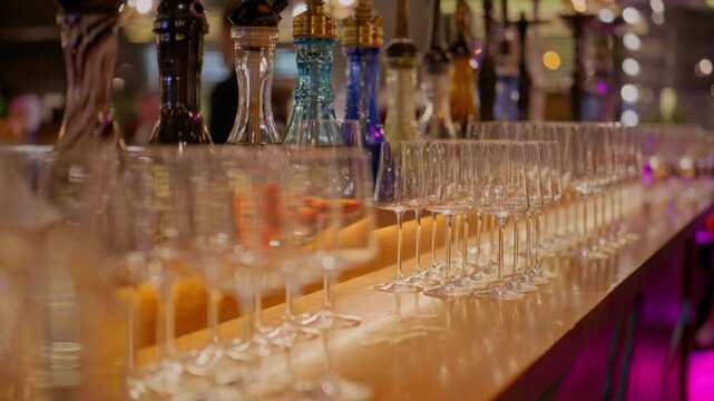 A clean glass goblet. Beautiful clean glasses in a bar and restaurant. Thin glass goblet. Elegant look. Light reflection in a glass goblet.