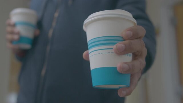 Close Up Perspective of a Man Sharing a Hot Drink