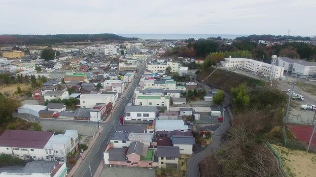 Aerial view of a coastal town in Fukushima, Japan. Residential areas and urban landscape.