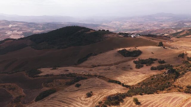 Aerial view of patchwork farmland on rolling hills