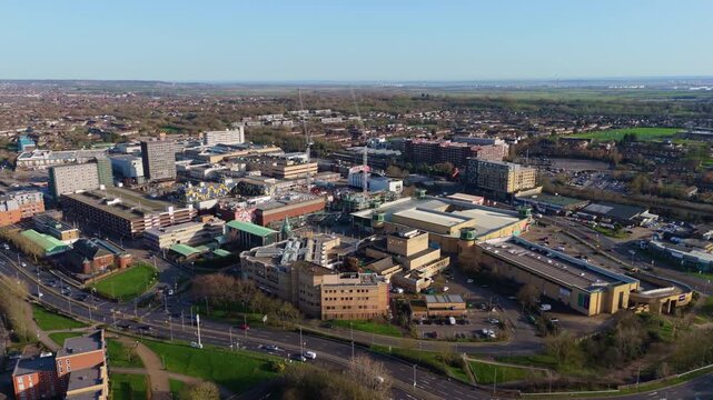 Aerial establishing shot of Basildon, UK, with cityscape and construction site