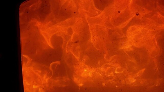 Dynamic fire flames and abstract light patterns creating a warm, energetic, and cozy background texture