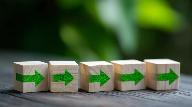 181Close-up of wooden blocks forming workflow sequence, green background, flowchart concept visualizing automated business processes, cubes representing operational steps and manageme