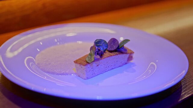 A gourmet dinner at a restaurant. Gastronomic food and dishes. Decorations and sophistication of signature dishes from the chef. Food as art. Bright colors of the dishes.