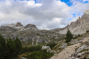 Fototapeta premium Wide view of Dolomite ridges with soft cloud cover in South Tyrol, Italy