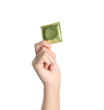 Woman holding condom on white background, closeup