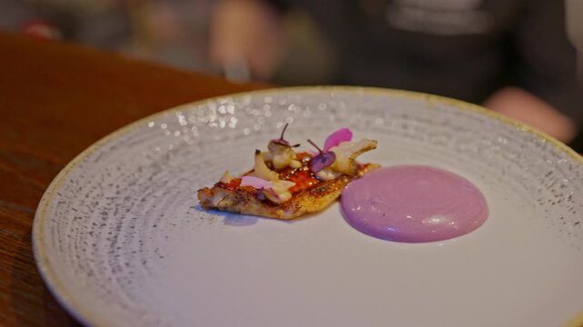 A gourmet dinner at a restaurant. Gastronomic food and dishes. Decorations and sophistication of signature dishes from the chef. Food as art. Bright colors of the dishes.