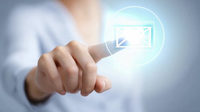 Digital Communication: An individual finger points towards a glowing email icon, symbolizing modern digital communication and connectivity. 