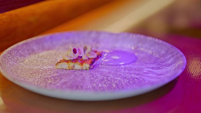 A gourmet dinner at a restaurant. Gastronomic food and dishes. Decorations and sophistication of signature dishes from the chef. Food as art. Bright colors of the dishes.