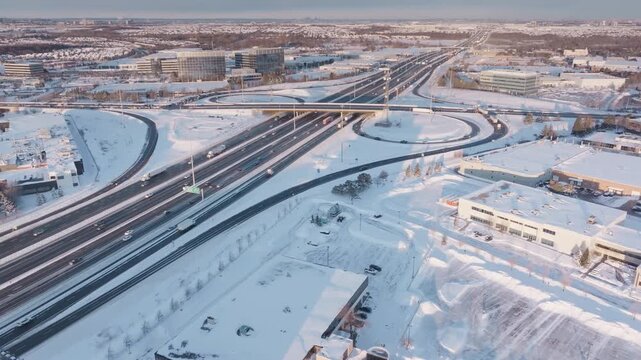 Aerial view of snowy HWY 401 in Mississauga, Ontario at sunset