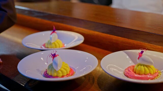 A gourmet dinner at a restaurant. Gastronomic food and dishes. Decorations and sophistication of signature dishes from the chef. Food as art. Bright colors of the dishes.