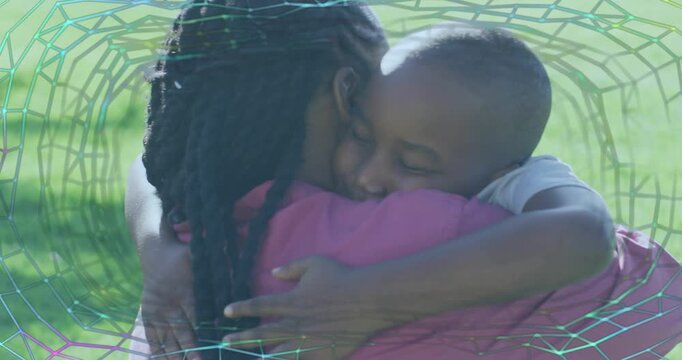 Father and son hugging after boy wrapping arms, transparent digital overlay visualizing health bond