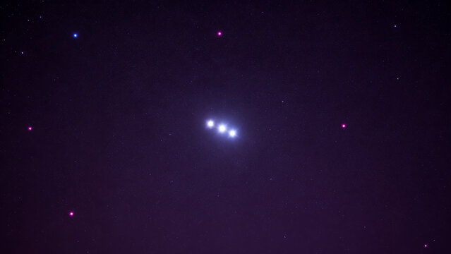 Celestial Cluster of Bright Stars Glowing in Deep Purple Night Sky with Scattered Distant Pinpricks of Light for Astronomy or Space Themed Design