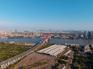 Fototapeta premium Aerial view of Guangzhou: liede bridge, cityscape, urban skyline with metro station, blue sky, pearl river