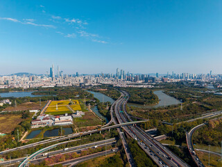 Aerial view of Guangzhou skyline and highway, transport traffic road with vehicle movement