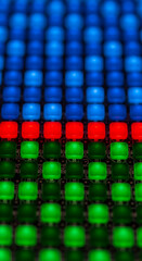 Fototapeta premium Close-up of led grid with blue, red and green lights, representing technology, digital interface, connection and pattern ideal for high-tech concepts