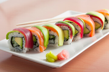 Sushi and maki rolls with salmon, avocado, tuna, and cucumber © hansgeel