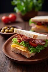Delicious blt sandwich with fresh ingredients and crispy bacon on rustic wooden table