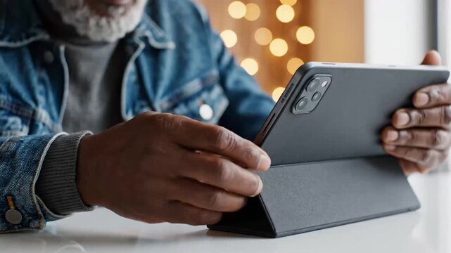 Senior Man Using Tablet, Browsing, and Interacting.