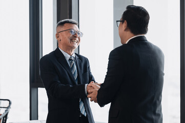 Professional handshake between two executives symbolizing partnership, agreement, and trust..