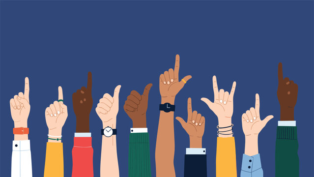 Diverse group of hands with different skin tones and accessories raised against a dark blue background showing unity and variety.