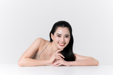 Obraz premium Beautiful asian woman smiling showing care teeth and glowing face skin makeup, for advertise skincare product, self care and cosmetics concept.