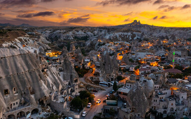 View of Goreme village with Uchisar castle in the background at sunset. Cappadocia. Nevsehir Province. Turkey
