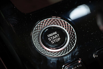 Obraz premium Close up of engine start stop button in car console
