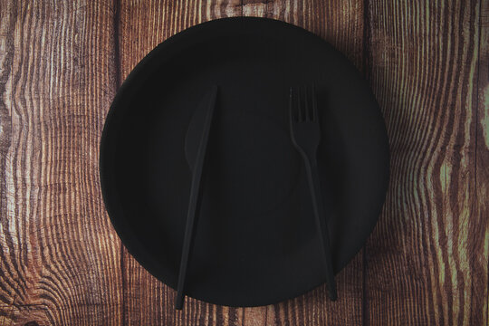 black wooden table and black fork