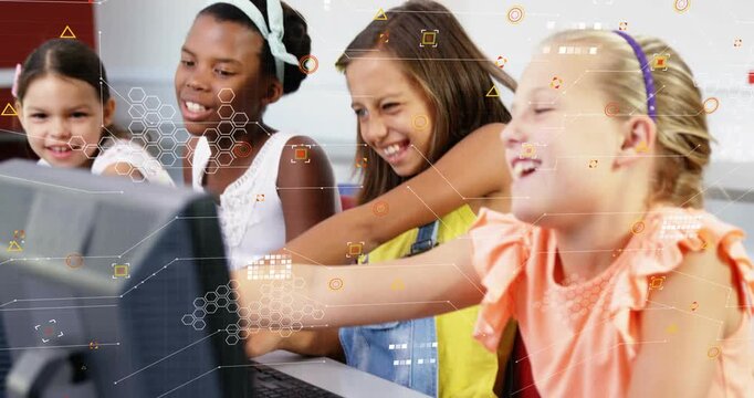 Camera focusing on keyboards girls leaning and typing at class monitor HUD overlay guiding learning