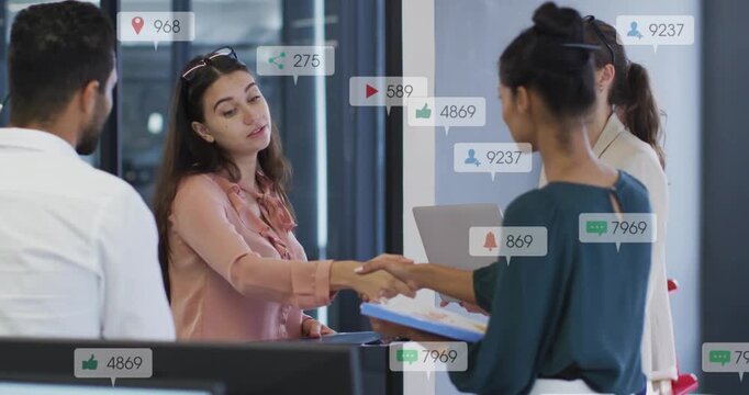 Two women shaking hands exchanging docs introducing for business starting animated icons over team