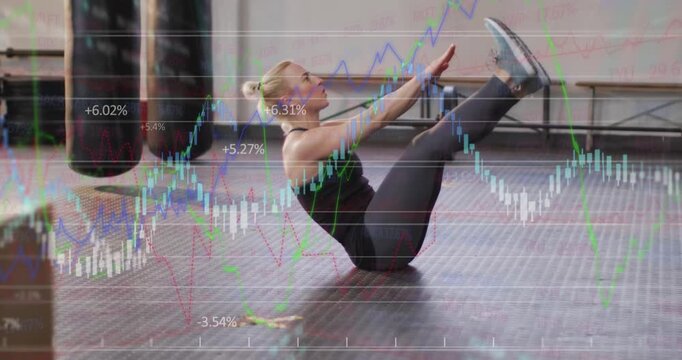 Woman performing repeated V-up core curls, lifting head and shoulders, financial charts overlaying