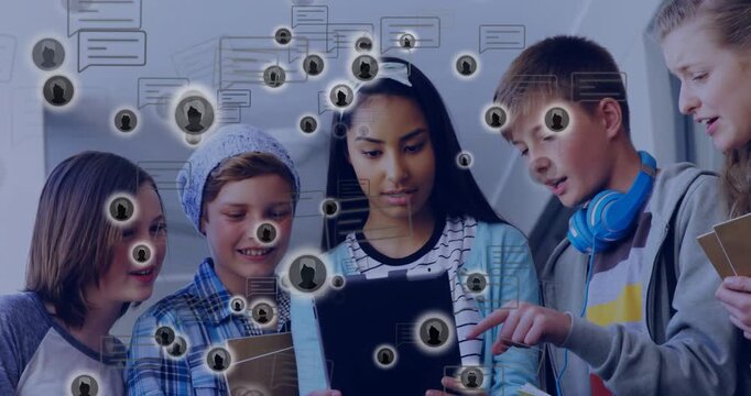 Pupils leaning over tablet in school studying, boy tapping screen causing avatars crossing faces