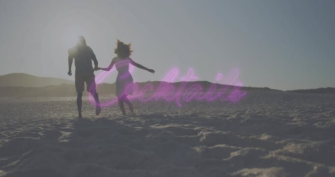 Couple holding hands walking and running toward horizon sand sun sinking brightening neon script