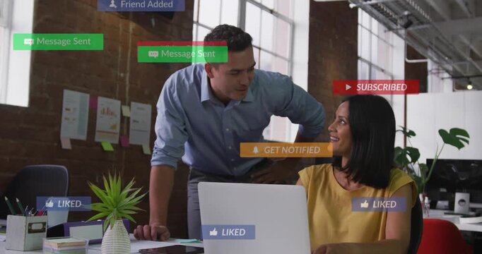 Man leaning over woman peer, laptop popping social icons covering desk then clearing in marketing