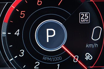 Fototapeta premium Close up of car dashboard in park mode with digital speedometer