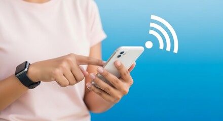 Close-up of woman's hands using smartphone showing Wi-Fi signal icon on blue background