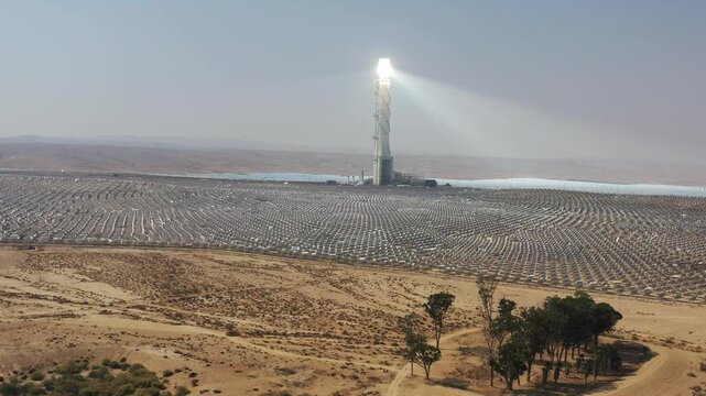 Aerial view of Ashalim solar power station tower and heliostats in the Negev desert wilderness Israel