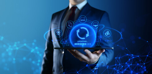Businessman Holding Device with Update Icons on Screen. Software Updating or Upgrade Concept