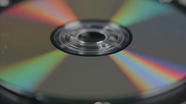 Rainbow Spectrum on Compact Disc - This macro shot reveals the colorful rainbow spectrum created by light diffraction on a spinning compact disc.