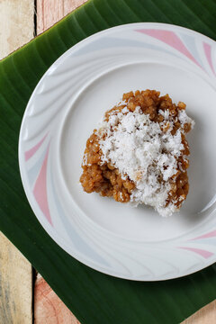 Top view of Rok Orok Bugghul, traditional Madurese sweet snack from Sampang made of cassava flour and palm sugar with grated coconut