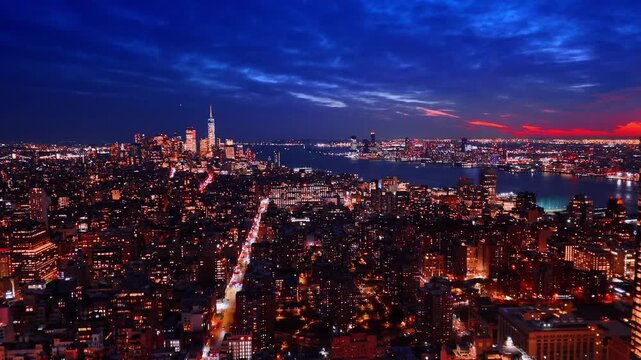 Dazzling scenery of gorgeous New York, USA. Lights of metropolis at night from drone.