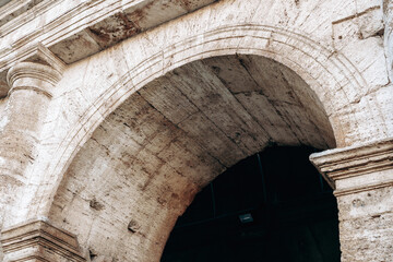 Naklejka premium Ancient archway shows stone craftsmanship in historical building from a historic time period