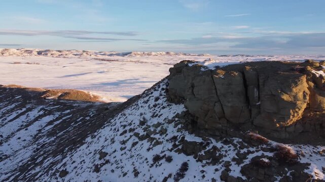 Orbit around sandstone rocks in winter 