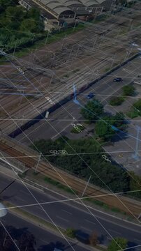 Vertical video: Road-rail overlays shifting after camera tilt while cars, truck moving mapping flow