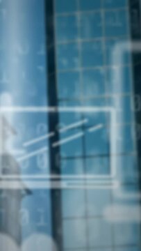 Vertical video: Glass tower showing HUD panel, camera nudging and blurring to reveal facade