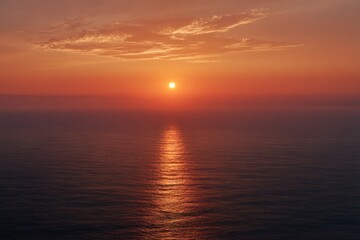 Golden Sunset Over Calm Ocean Waters with Reflective Path and Serene Horizon.
