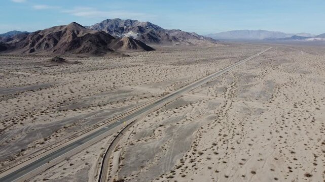 Single road in desert landscape aerial 