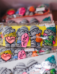 Tourist gifts and Korean souvenirs from Jeju Island, Jeju-do, South Korea, tangerine hallabong figures in orange color, knitted toys, fridge magnets, key ring keychain, a local gift vendor shop market